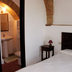 bedroom in the apartment, la torre di ranza farm, san gimignano